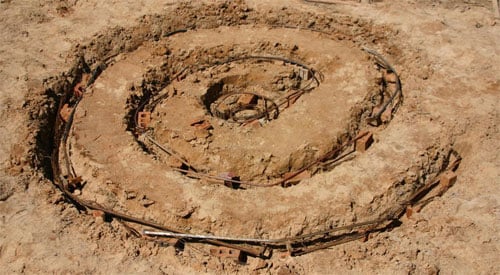 Foundation of a brick herb spiral