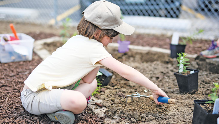 Kid working in a garden