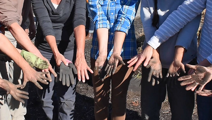 People showing off their dirty hands