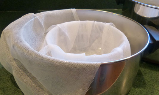 Line colander with cheesecloth