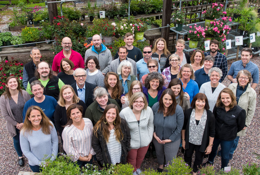 Group shot of Gardener's Supply employees in retail store greenhouse