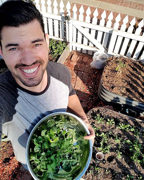 Kevin Espiritu with bowl of greens