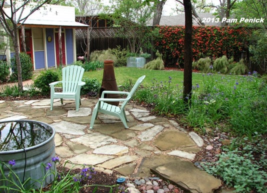 Replace half the lawn with a patio and garden bed