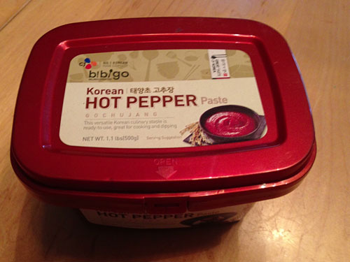 a container of bibigo korean hot pepper paste 
