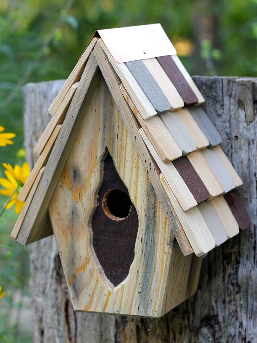 T pot fashioned into a wren birdhouse